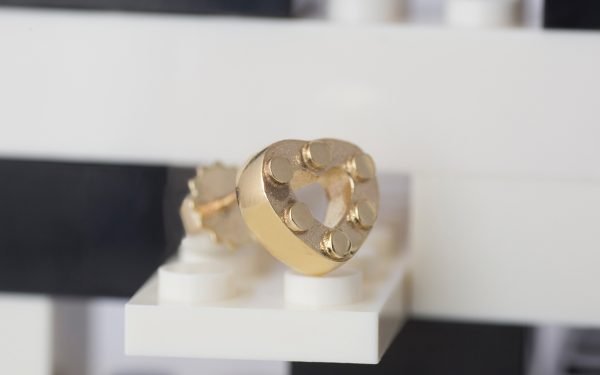 gold heart earring with studs on lego